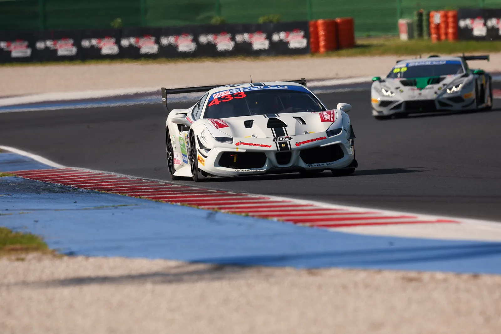 No. 433 racing wheel to wheel with a Lamborghini at Misano